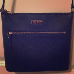 Black kate spade crossbody with gold accents